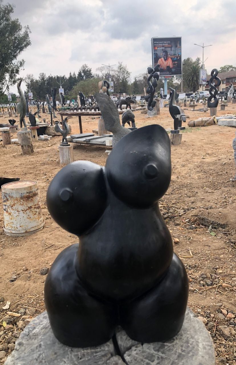 Abstract Black Stone Sculpture of a Human Figure with Curves