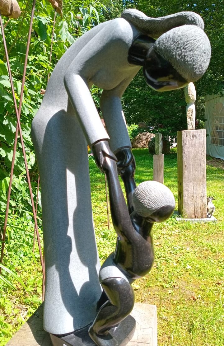 Outdoor Sculpture of a Mother and Child Symbolizing Love and Nurturing