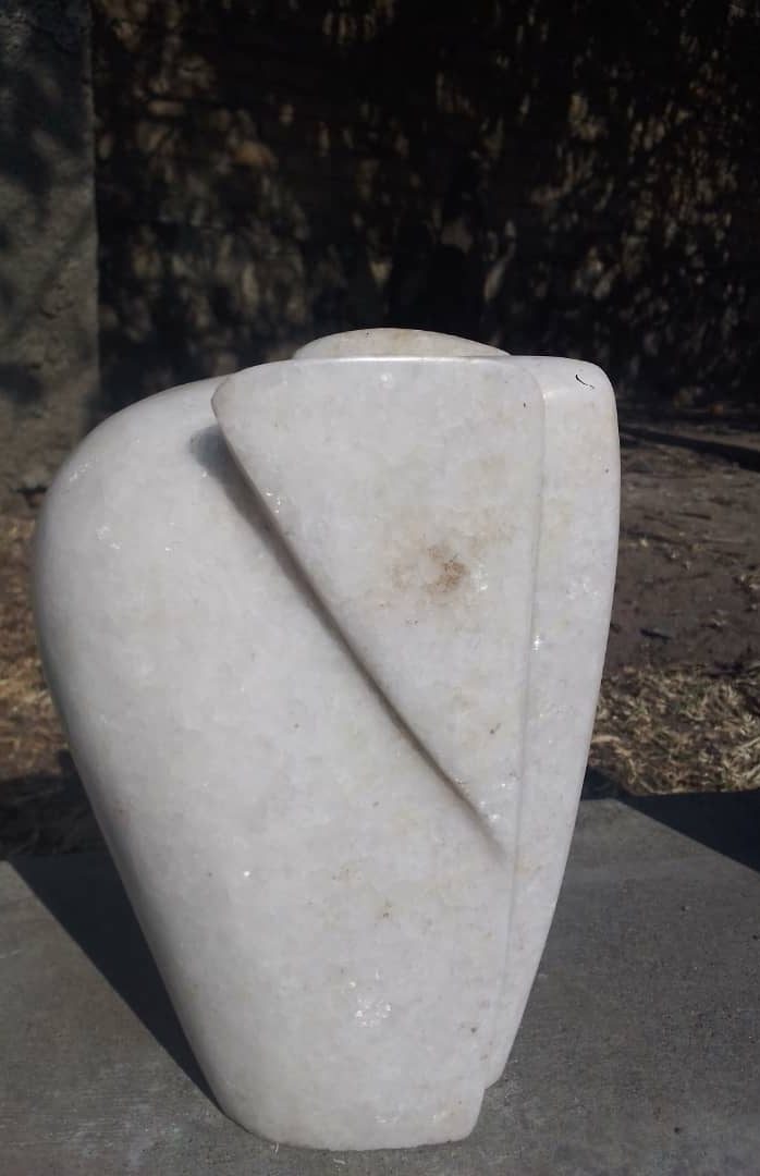 Abstract White Stone Elephant with Geometric Design