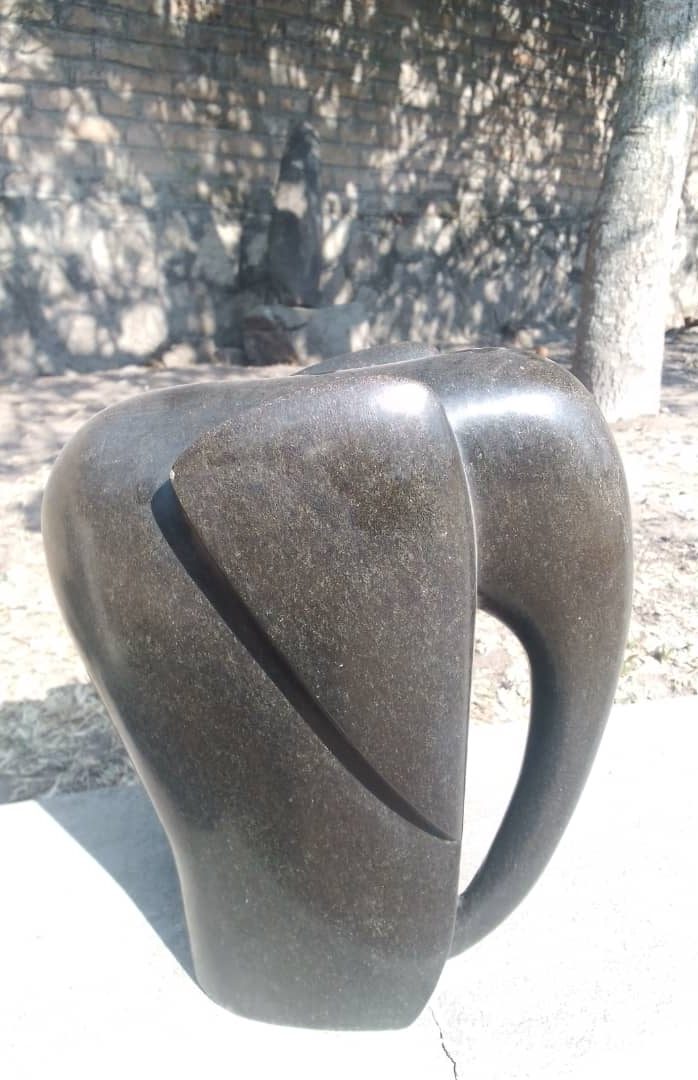 Abstract Dark Elephant Sculpture with Curved Lines and Unique Silhouette